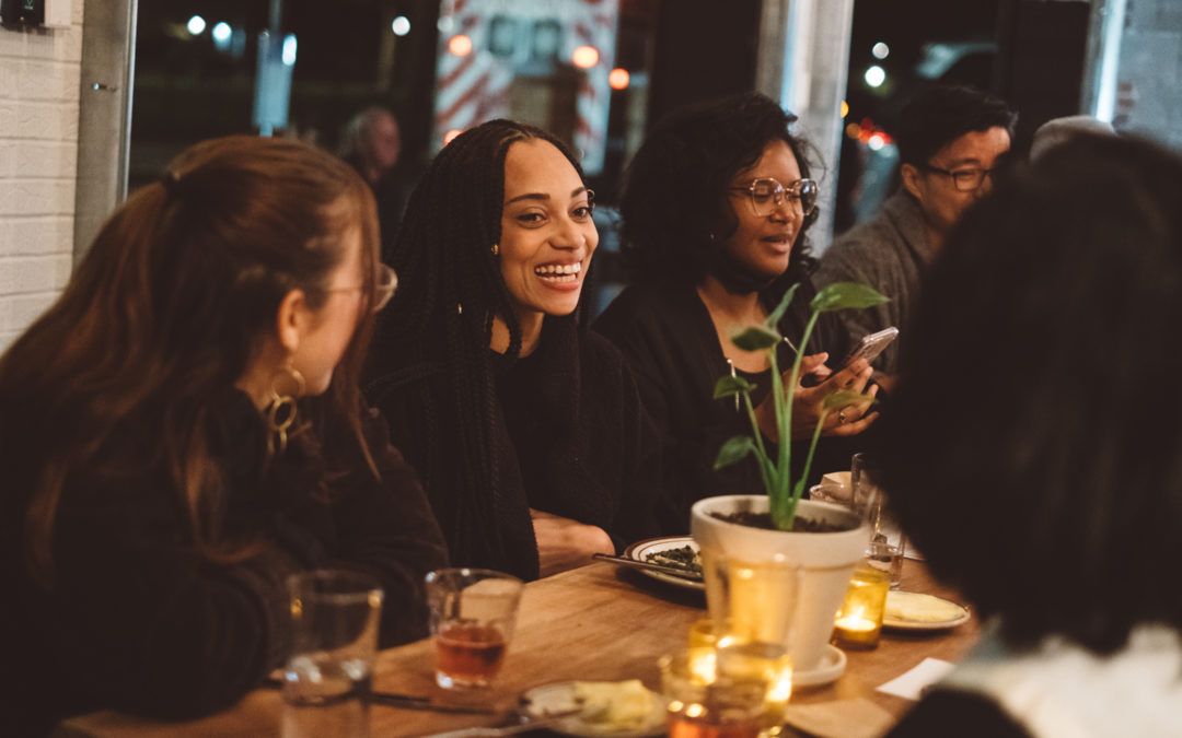 Image of international neighbors gathering for a communal dinner