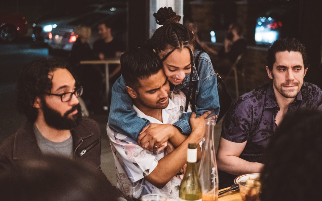 Image of neighbors hugging community and mental health